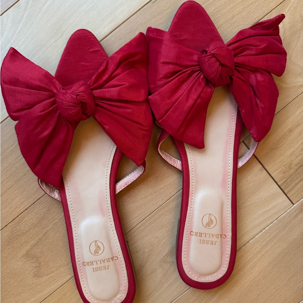 Jessi Caballero red flats with oversized bow design